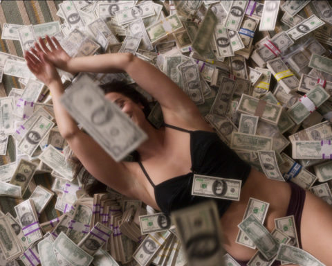 woman rolling in money