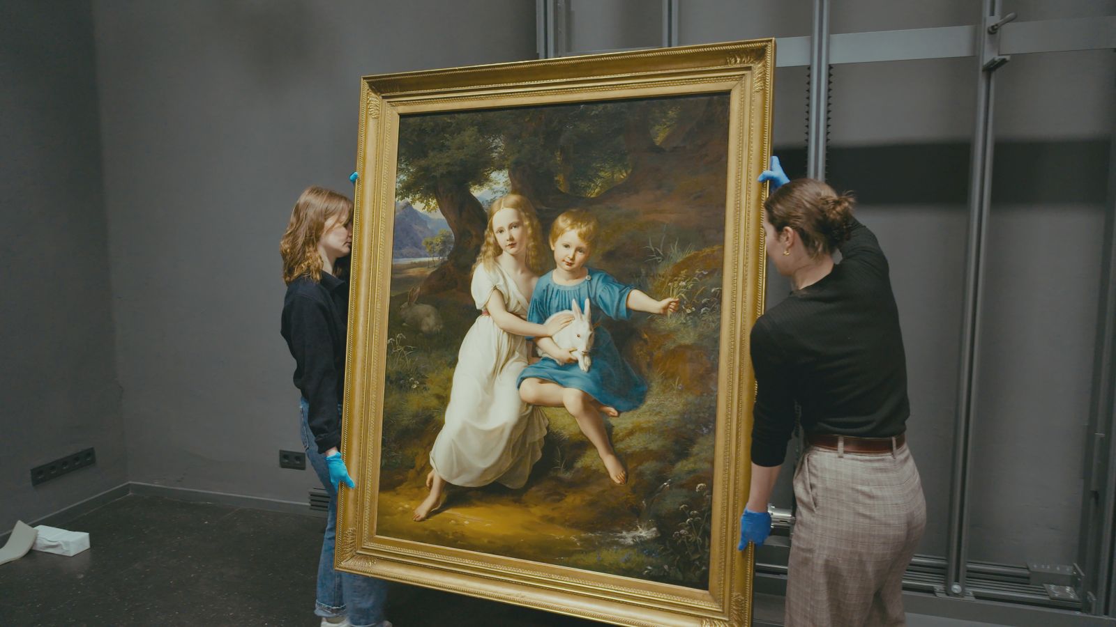 Painting titled Die Kinder Des Künstlers by Friedrich Wilhelm von Schadow, being carried in Dusseldorf gallery.