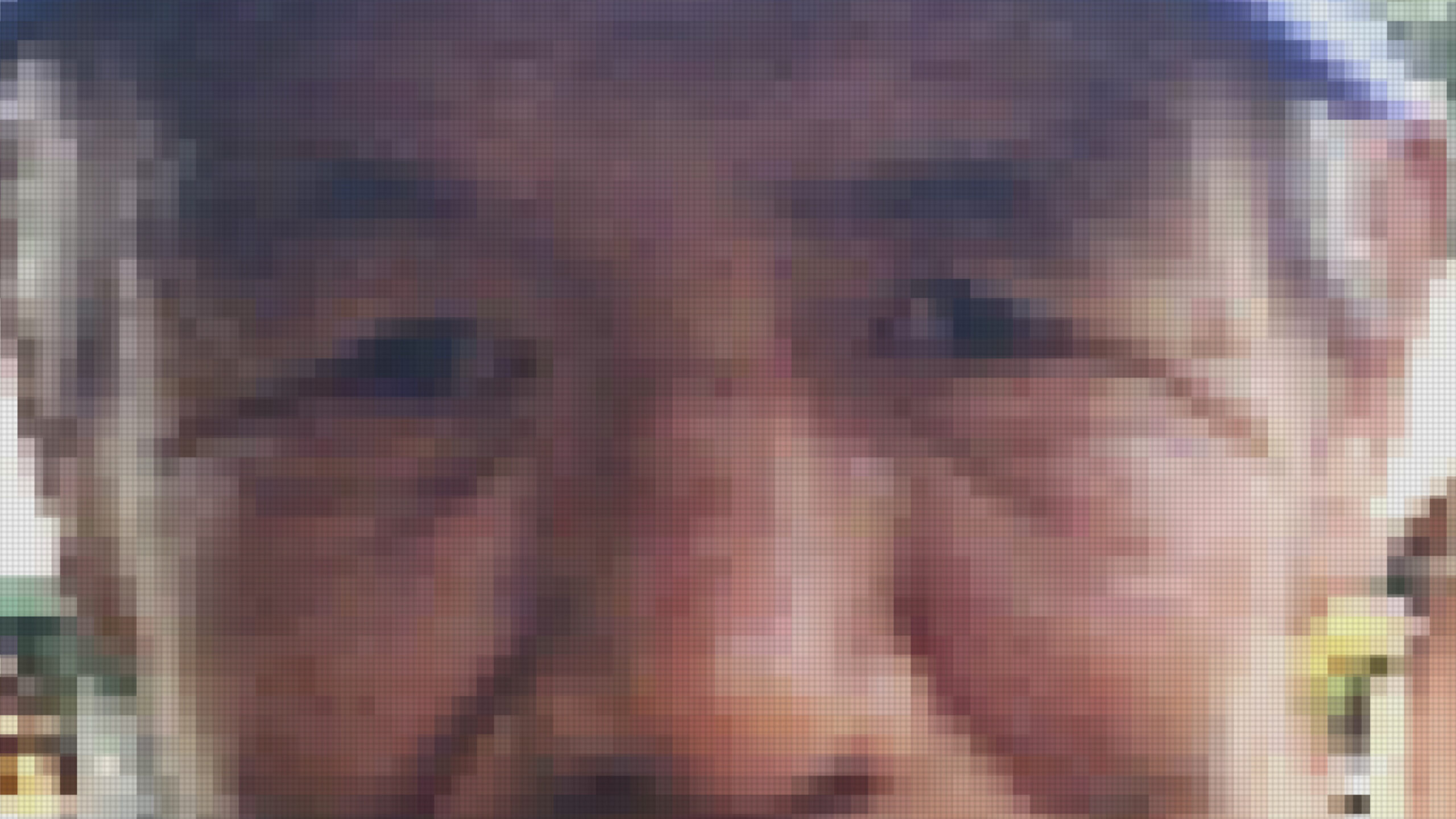 A pixelated image of an elderly Indigenous man's face. Only his nose, eyes, cheeks, and ears are visible with the line of a blue hat at the top of the frame.