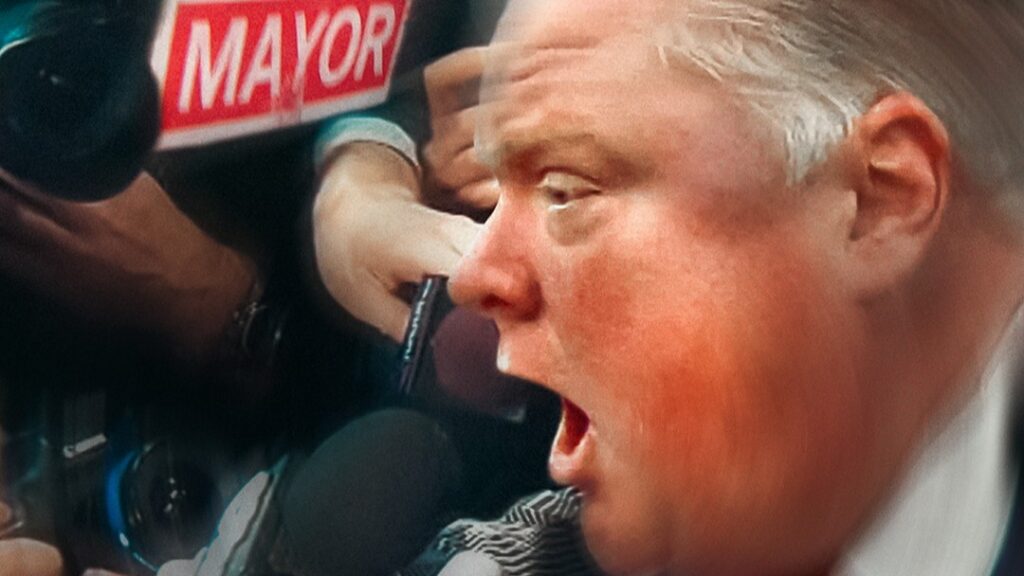A close up image of former Toronto mayor Rob Ford as he yells into a microphone.