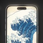 An illustration of a tsunami. A blue wave is viewed through a window frame.