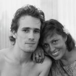 A black and white photo of singer Jeff Buckley and his mother Mary. They have their heads together and are smiling.