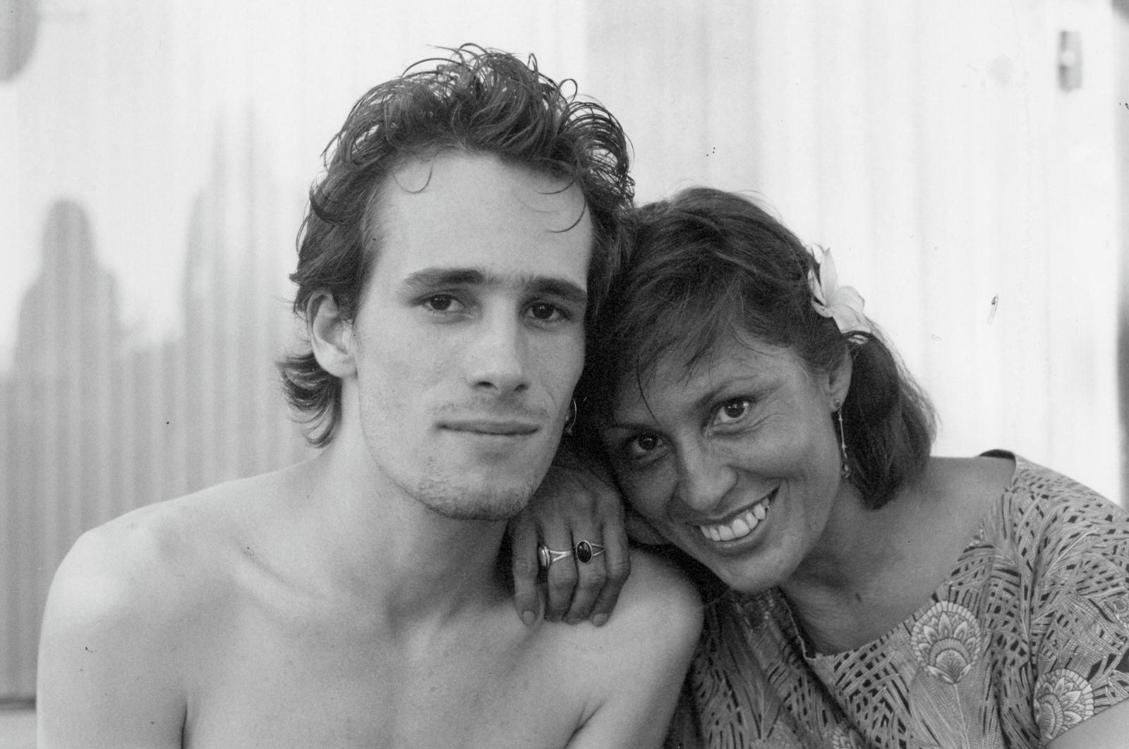 A black and white photo of singer Jeff Buckley and his mother Mary. They have their heads together and are smiling.