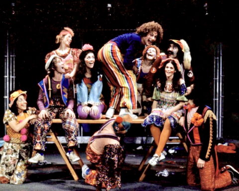 An archival photo of the cast of the Toronto 1972 production of Godspell on the stage.