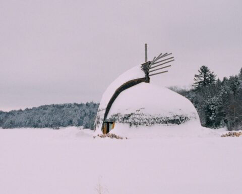 An structure in a Northern Indigenous community sits amid a snowy landscape.