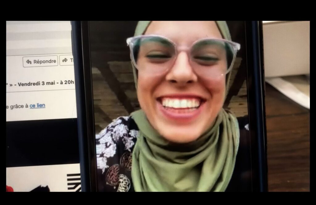 Palestinian journalist Fatma Hassouna appears on a video call on a phone.