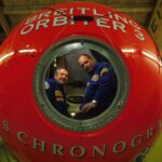 Brian Jones and Bertrand Piccard are pictured in Breitling Orbiter 3, a red sphere that housed their balloon adventure