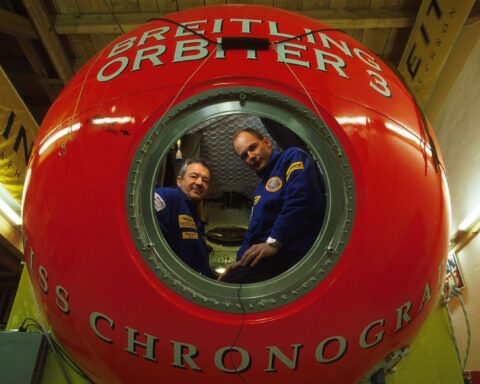 Brian Jones and Bertrand Piccard are pictured in Breitling Orbiter 3, a red sphere that housed their balloon adventure