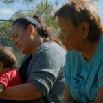 Saik’uz Elder Minnie Thomas, Saik’uz First Nation Councillor Jasmine Thomas and baby. Image courtesy of the National Film Board of Canada, Lantern Films, and Experimental Forest Films.