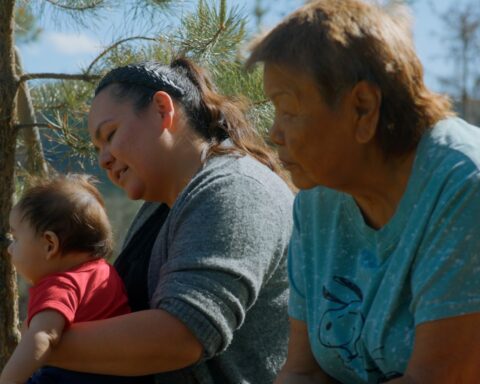 Saik’uz Elder Minnie Thomas, Saik’uz First Nation Councillor Jasmine Thomas and baby. Image courtesy of the National Film Board of Canada, Lantern Films, and Experimental Forest Films.