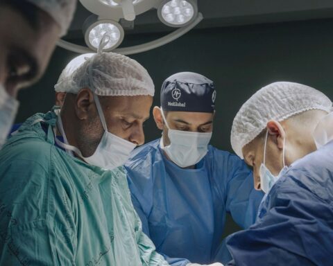 A team of doctors in an operating room.
