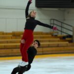 Ice dancers Piper Gilles and Paul Poirier do a lift while training.