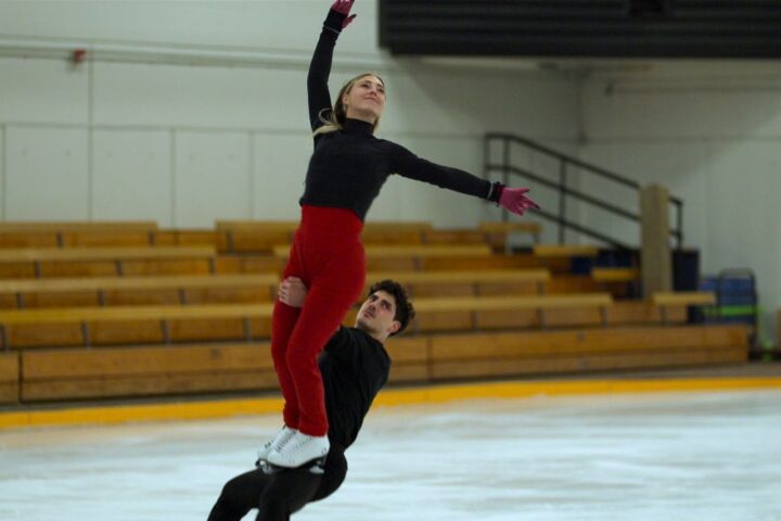 Ice dancers Piper Gilles and Paul Poirier do a lift while training.