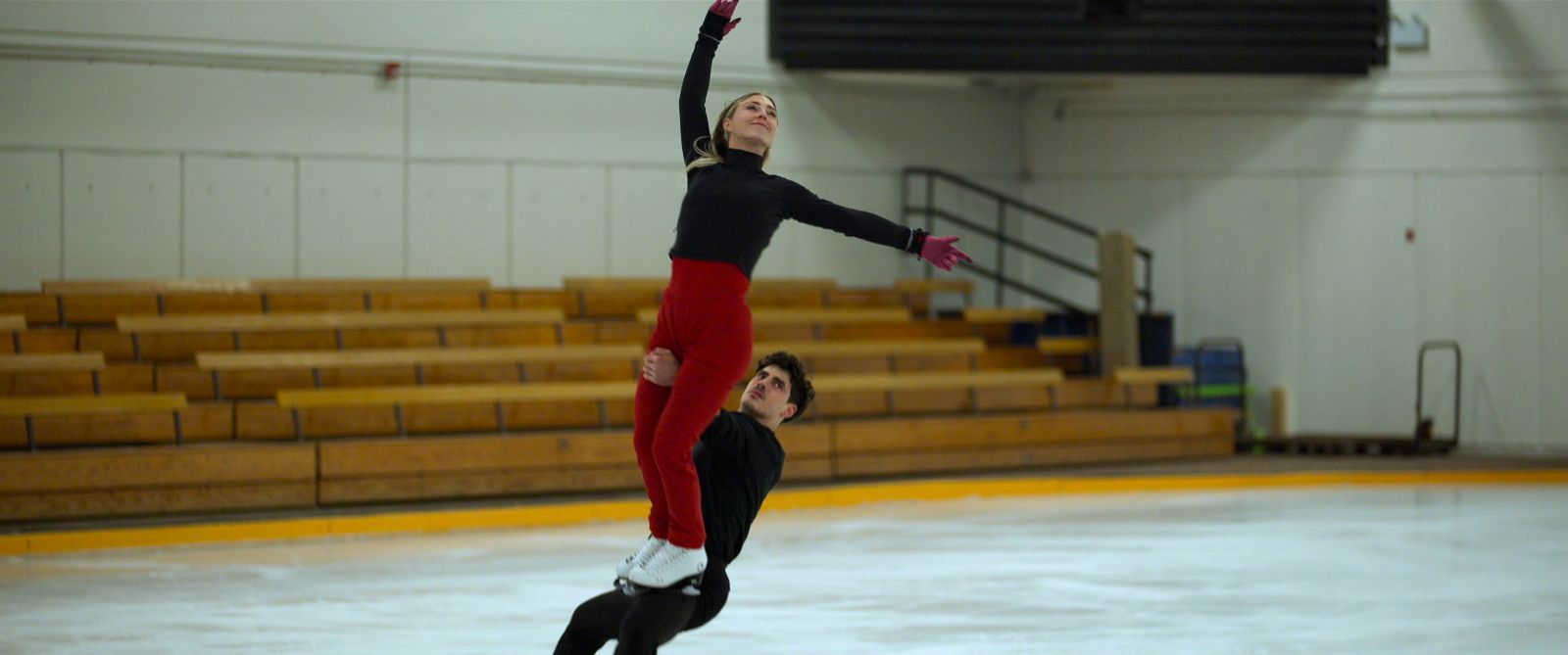 Ice dancers Piper Gilles and Paul Poirier do a lift while training.