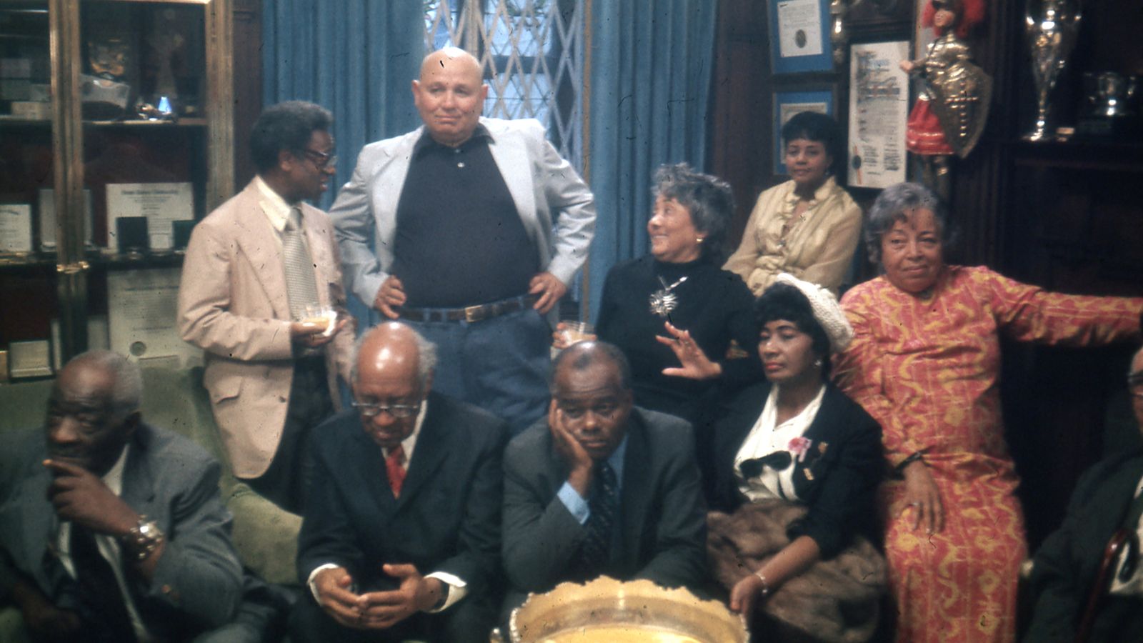 Sitting (left to right): Thomas Harvey, William Patterson, John Henrik Clarke, Mrs. J.B Matthews, Louise Patterson. Standing (left to right): Ernest Chrichlow, Romare Bearden, Ida Mae Cullen. Photo taken in 1972. Credit: Bruce Stanford. Courtesy: William Greaves Productions