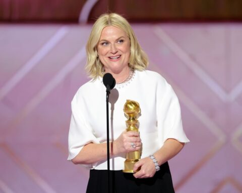 Amy Poehler accepts the Golden Globe for Best Podcast.