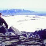 Árni Kjartansson sits overlooking a glacier in Iceland. | Courtesy of Andri Snær Magnason