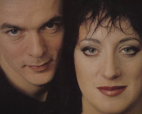 An archival image of Rough Trade musicians Carole Pope and Kevan Staples. They are pictured in close-up with their faces side by side.