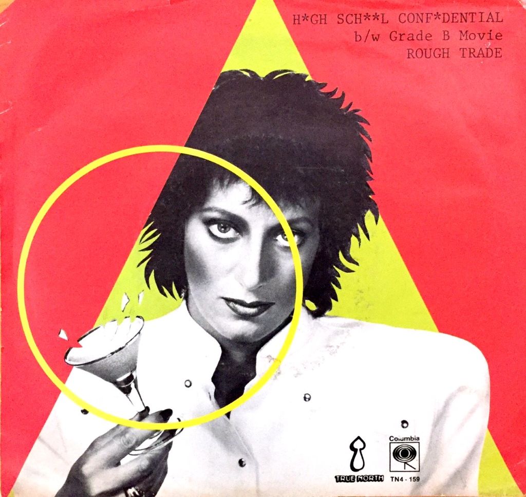 The cover for the "High School Confidential" EP. Singer Carole Pope is pictured in black and white holding a martini glass sideways. She is framed in a yellow triangle, which is atop a red square background.