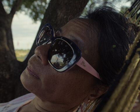 Lydia rests in a hammock, reflecting during a rare moment of stillness in the heat of the day.