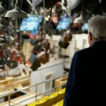 A view from behind producer Lorne Michaels as he looks out at the set of Saturday Night Live.