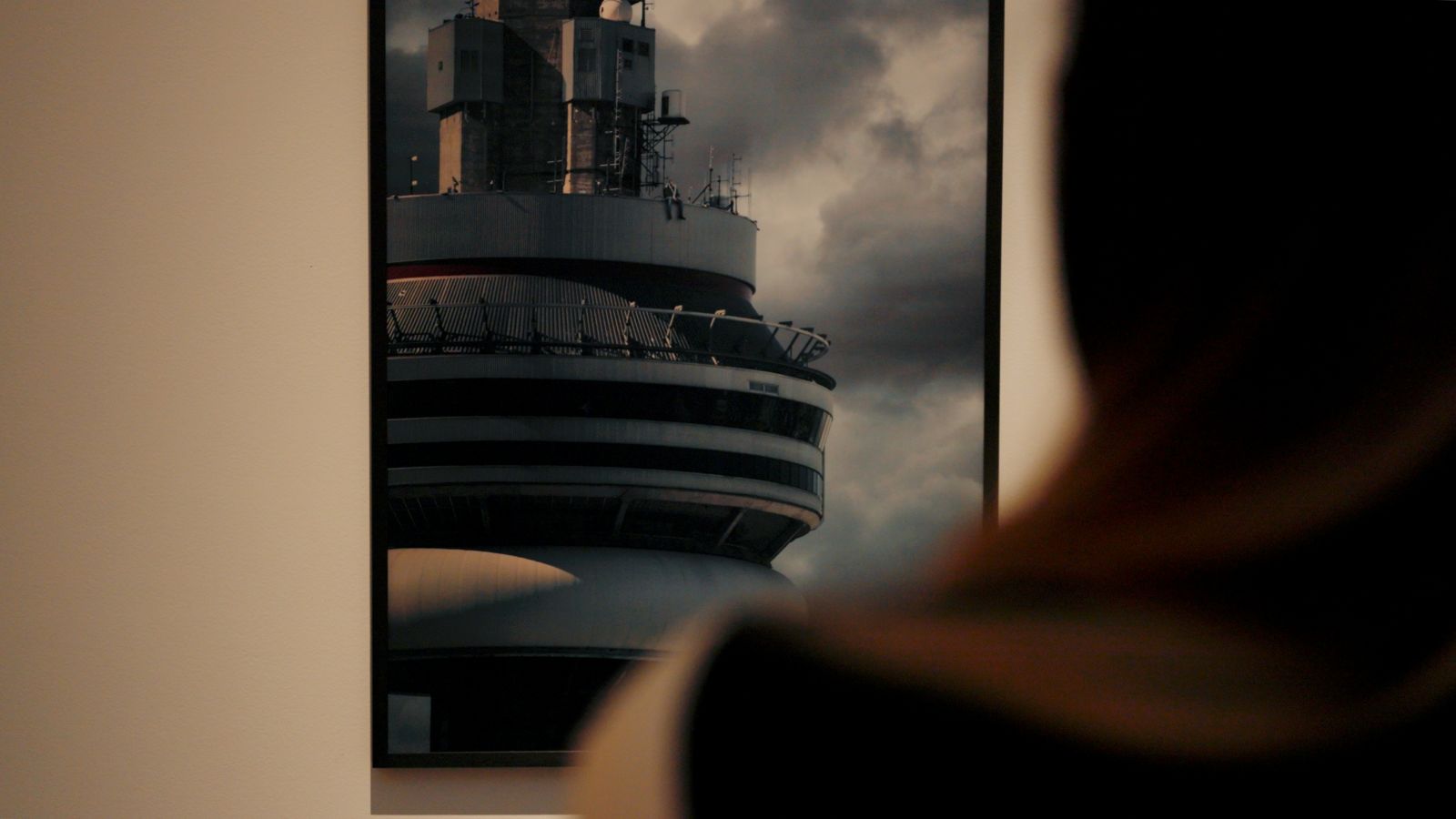 - Caitlin Cronenberg (foreground), looking at her photo of Drake’s Views album cover, hanging in the AGO.