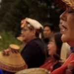 Nuskmata sings during a ceremony at the sputc pole on the bank of the Bella Coola River, honouring the fish and the enduring relationship between people and place.