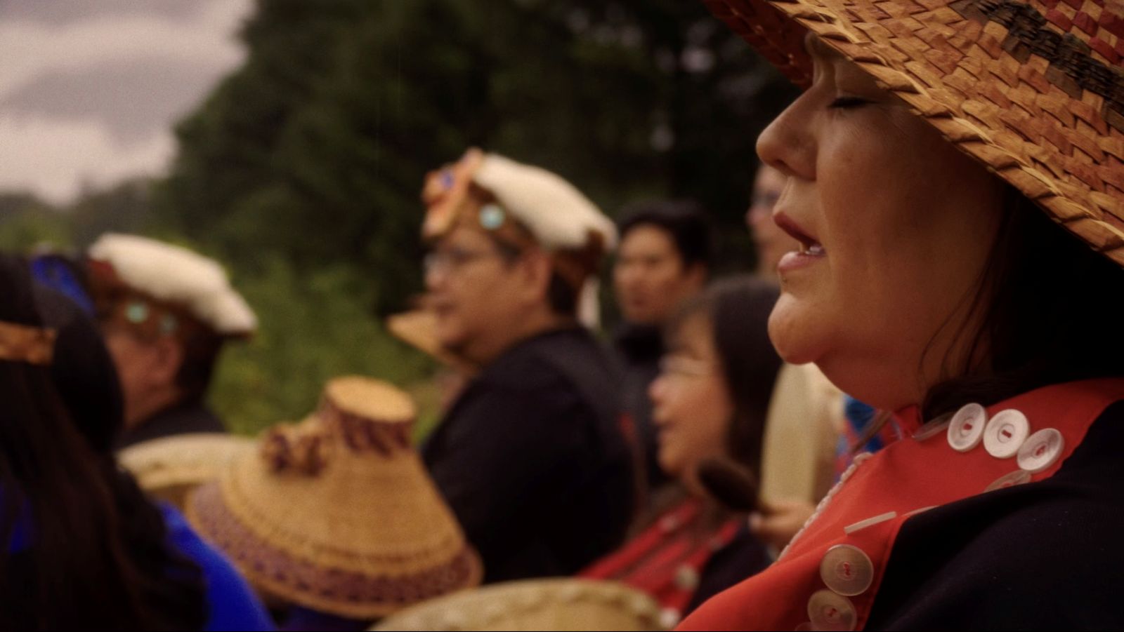 Nuskmata sings during a ceremony at the sputc pole on the bank of the Bella Coola River, honouring the fish and the enduring relationship between people and place.