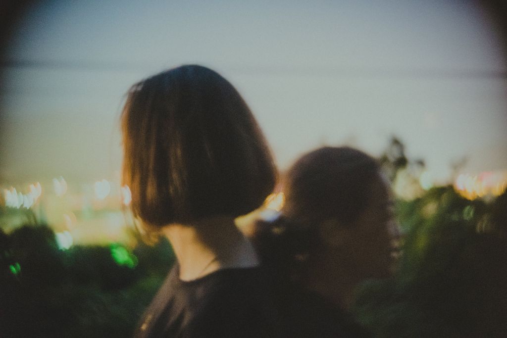 Cuc and Mai - mother and daughter duo,, on the hill overlooking the city where the story takes place