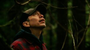Qwaxw visits the gravesite at Nusq’lst Village, confronting the legacy of smallpox and dispossession that reshaped Nuxalkulmc (Nuxalk Territory).