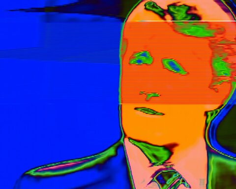 A fuzzy TV image in blue and orange negative shows Brian Mulroney giving an interview.