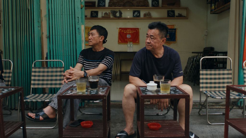 Carol's dad and his brother sitting at a Vietnamese café.