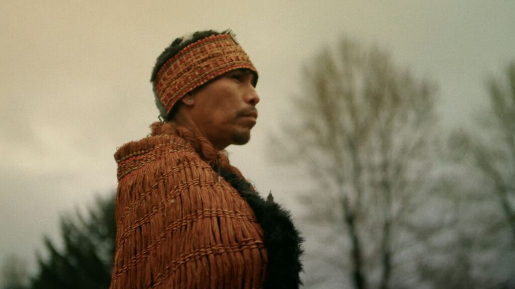 Nannika, representing the alhukwala (medicine person), stands during the sputc ceremony in Bella Coola Valley. The ceremony marks a return to ancestral practice after the collapse of the ooligan run.