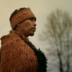Nannika, representing the alhukwala (medicine person), stands during the sputc ceremony in Bella Coola Valley. The ceremony marks a return to ancestral practice after the collapse of the ooligan run.