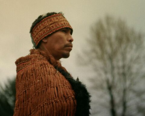 Nannika, representing the alhukwala (medicine person), stands during the sputc ceremony in Bella Coola Valley. The ceremony marks a return to ancestral practice after the collapse of the ooligan run.