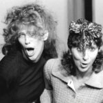 A black and white photo shows young comedians Catherine O'Hara and Andrea Martin making funny faces and being goody during a sketch for SCTV.