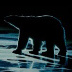 A silhouette of a polar bear at night.