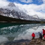 Icefields Pkwy, Banff National Park, Alberta, Canada - September 24, 2018: Photographers taking pictures of Beautiful Canadian Rockies Landscape during a cloudy day.