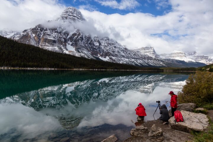 Icefields Pkwy, Banff National Park, Alberta, Canada - September 24, 2018: Photographers taking pictures of Beautiful Canadian Rockies Landscape during a cloudy day.